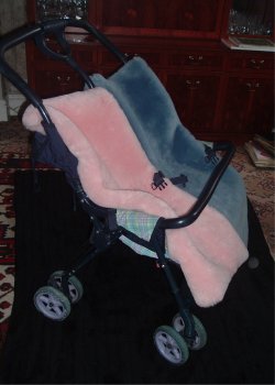 Baby blue and Pink shaped Cozifleece fleeces in a double buggy
