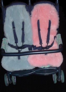 Baby blue and Pink shaped Cozifleece fleeces in a double buggy